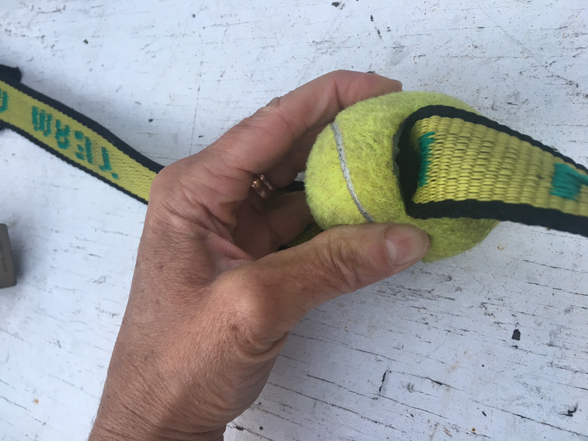 Tennis ball sliced for boat tie