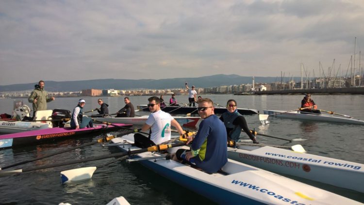 Coastal Rowing Club listen to coach Nikos